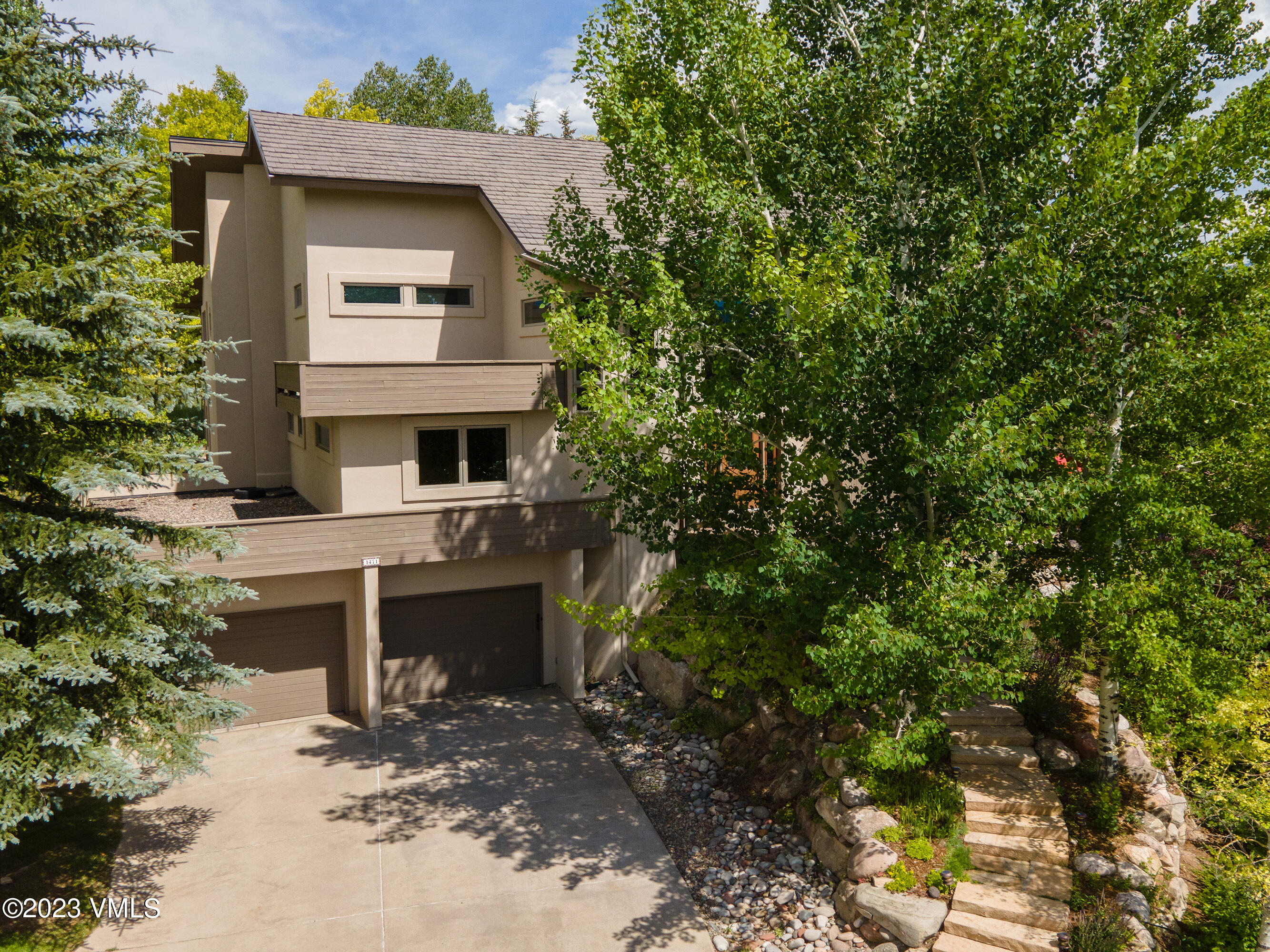 1471 Singletree Road Edwards, CO 81632 - Photo 33 of 47 a front view of a house with a yard
