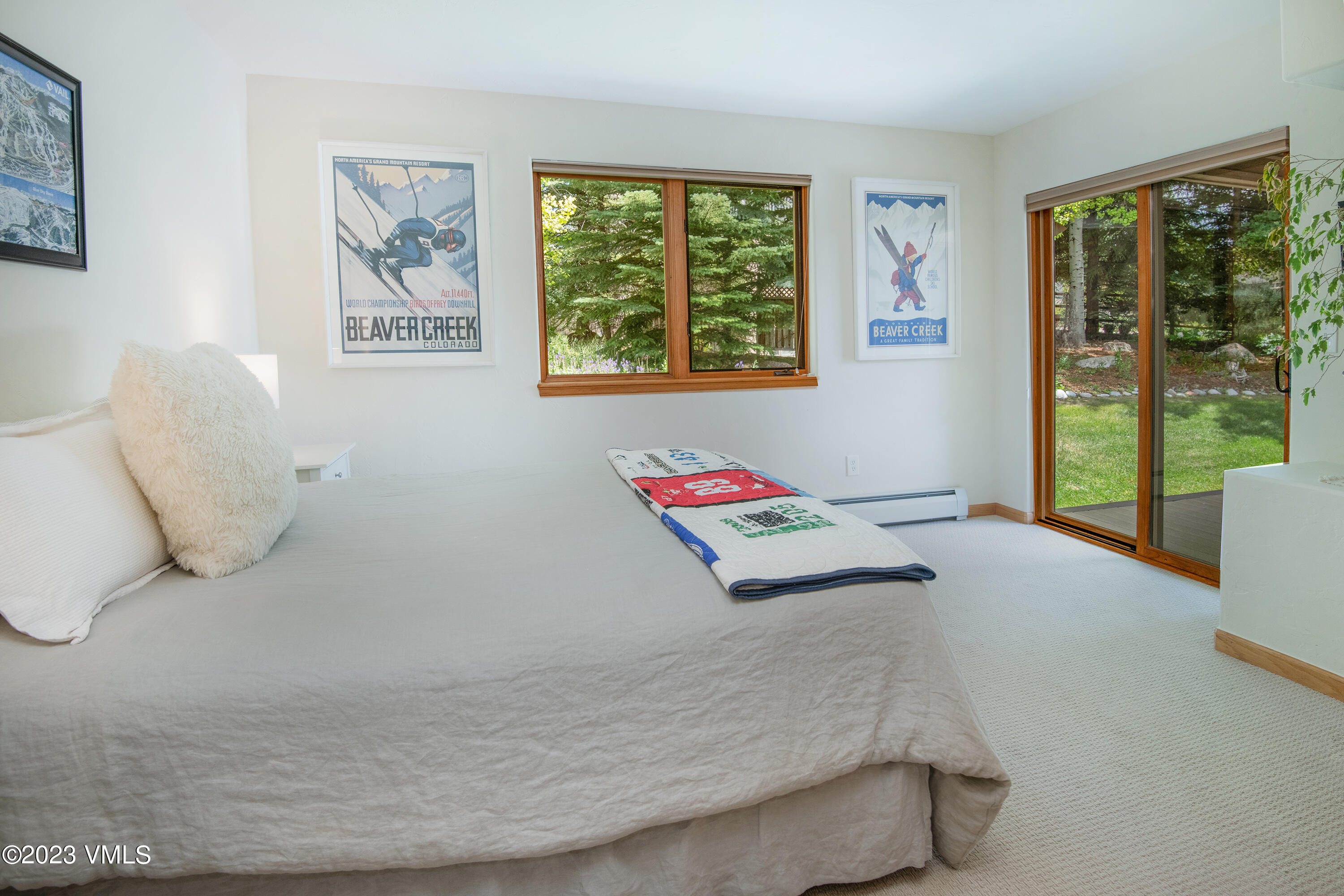 1471 Singletree Road Edwards, CO 81632 - Photo 36 of 47 a bedroom with a bed and glass window