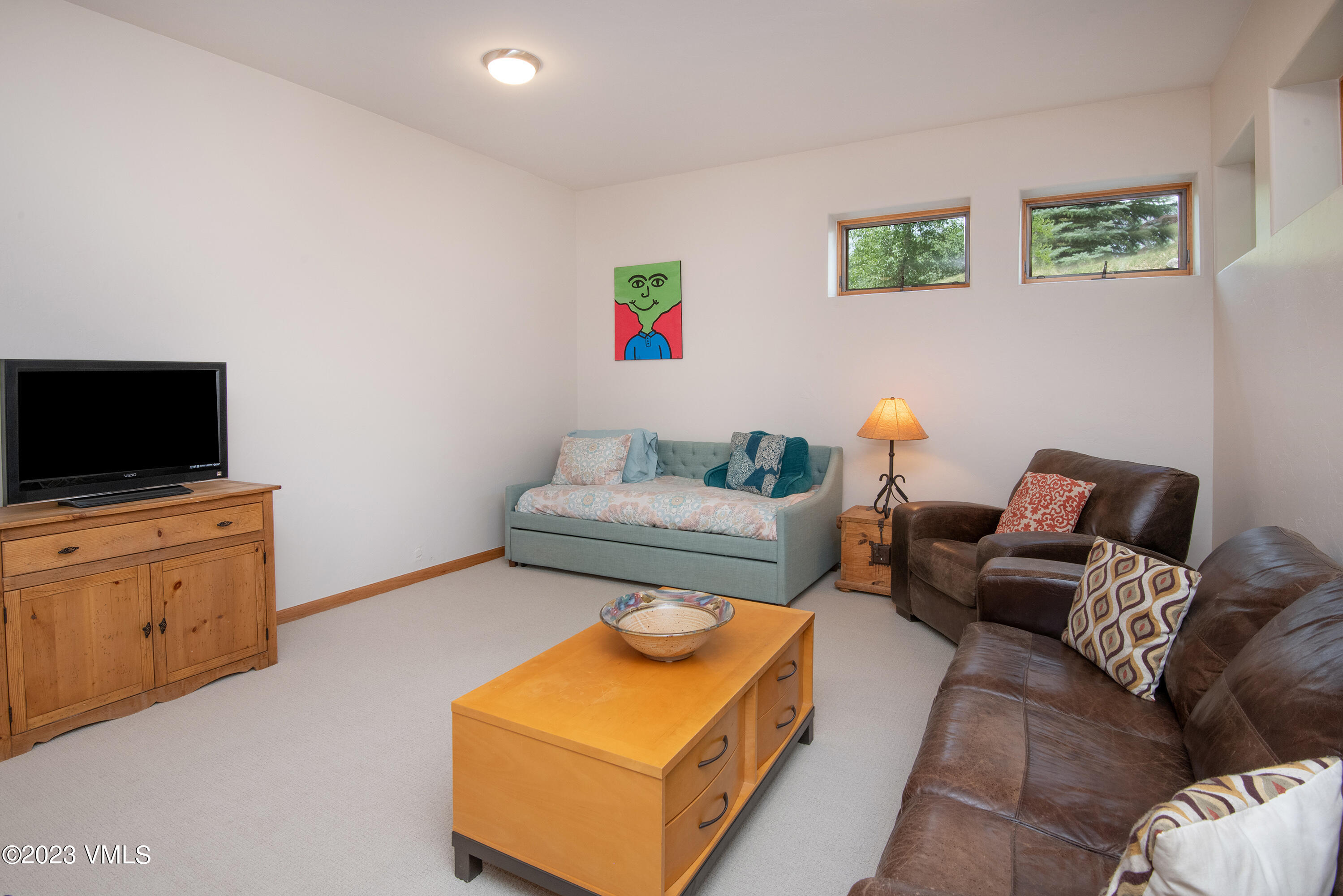 1471 Singletree Road Edwards, CO 81632 - Photo 40 of 47 a living room with furniture and a flat screen tv