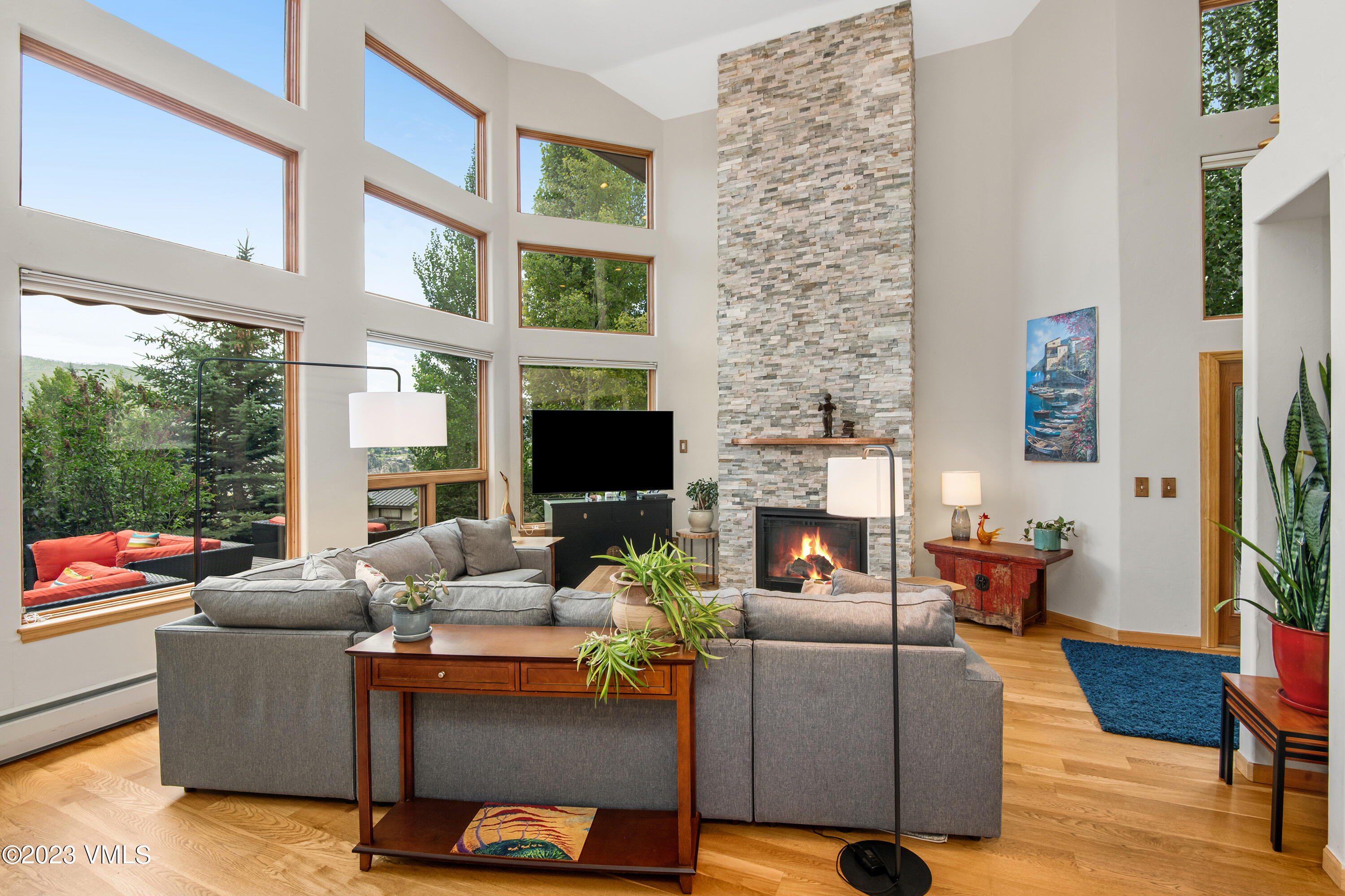1471 Singletree Road Edwards, CO 81632 - Photo 9 of 47 a living room with furniture a fireplace and a flat screen tv