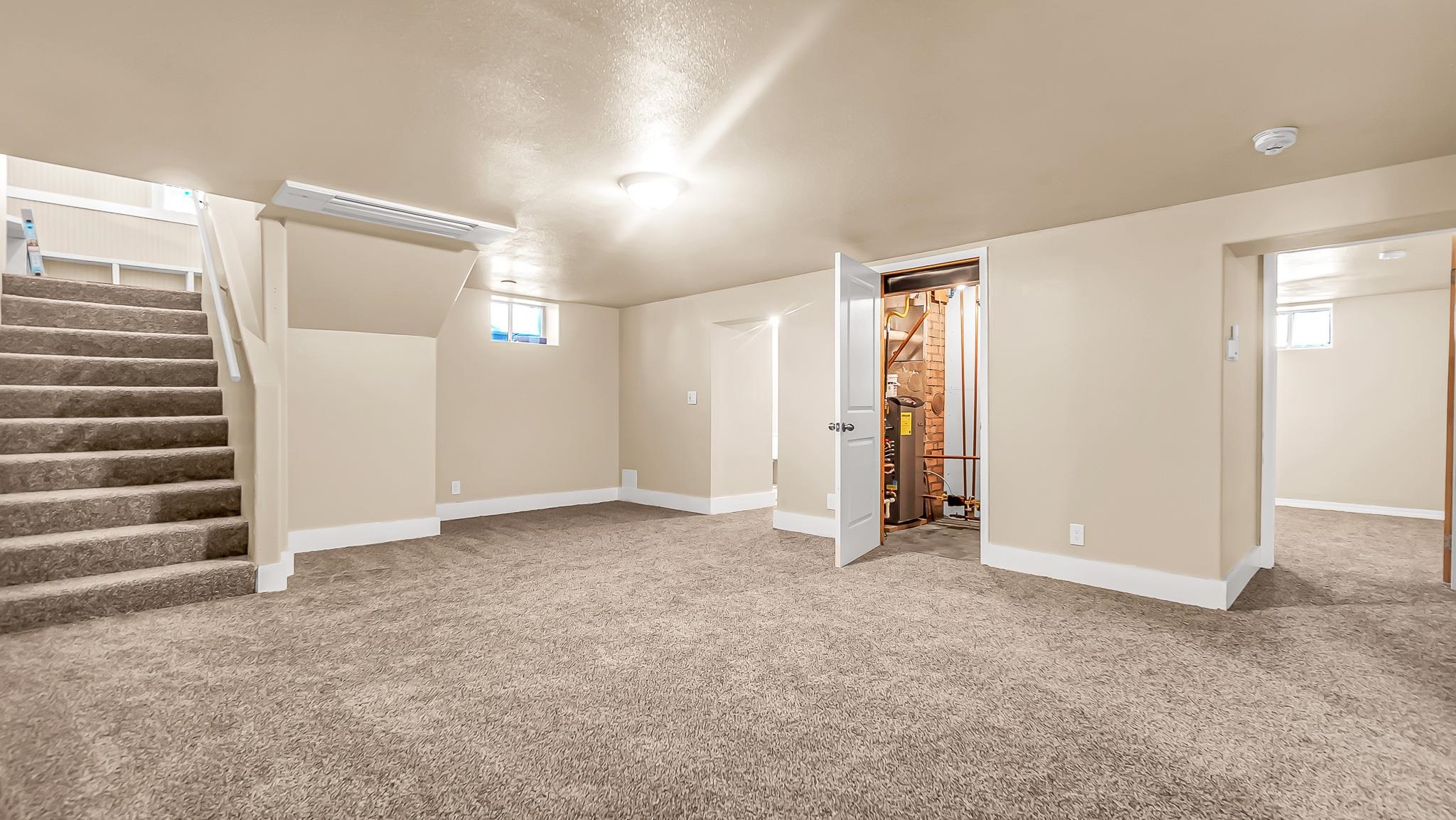 208 3rd Street Parachute, CO 81635 - Photo 20 of 40 a view of an empty room with stairs and ventilation