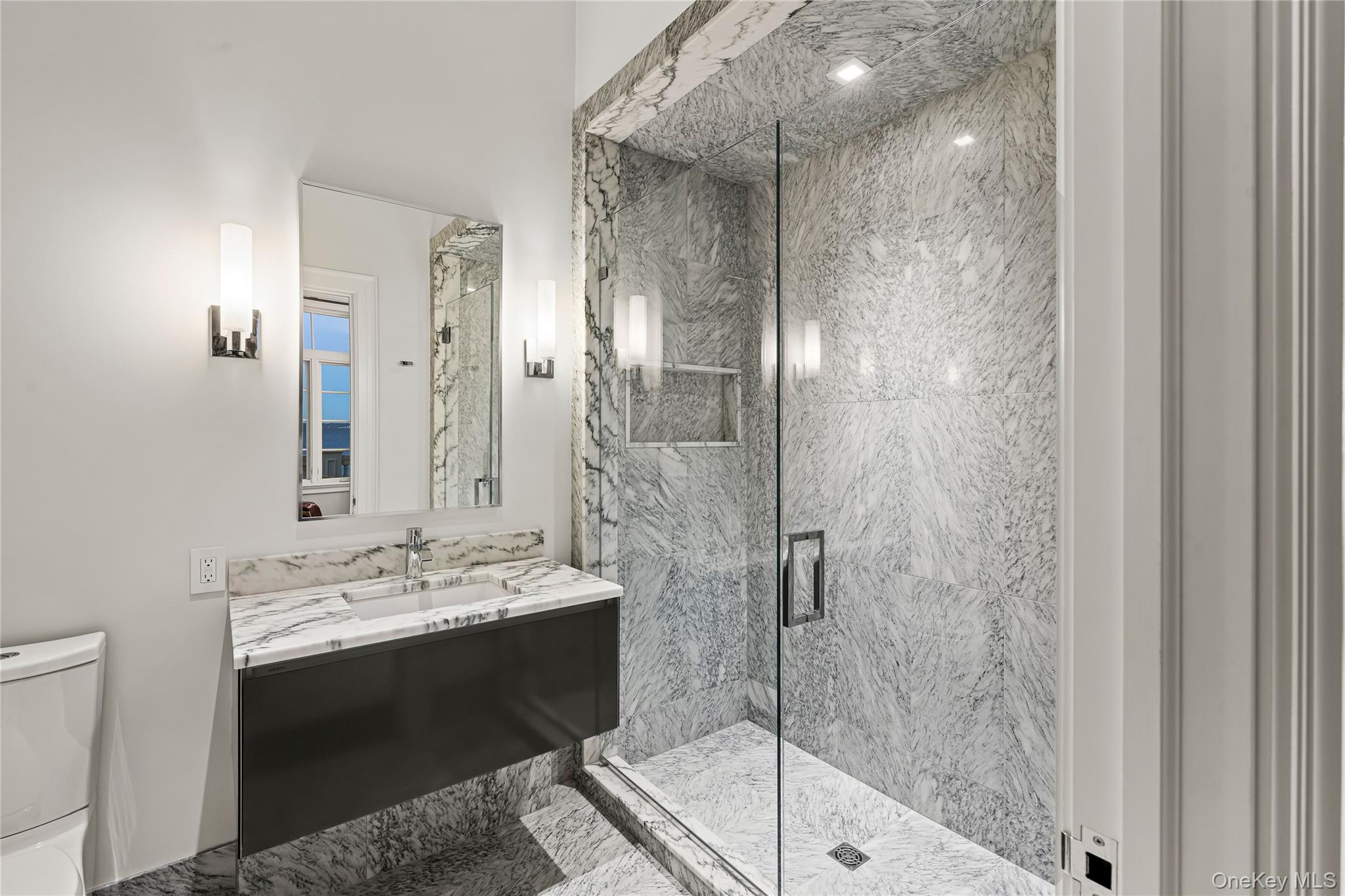106 Premium Point New Rochelle, NY 10801 - Photo 28 of 44 a bathroom with a shower a sink and a mirror
