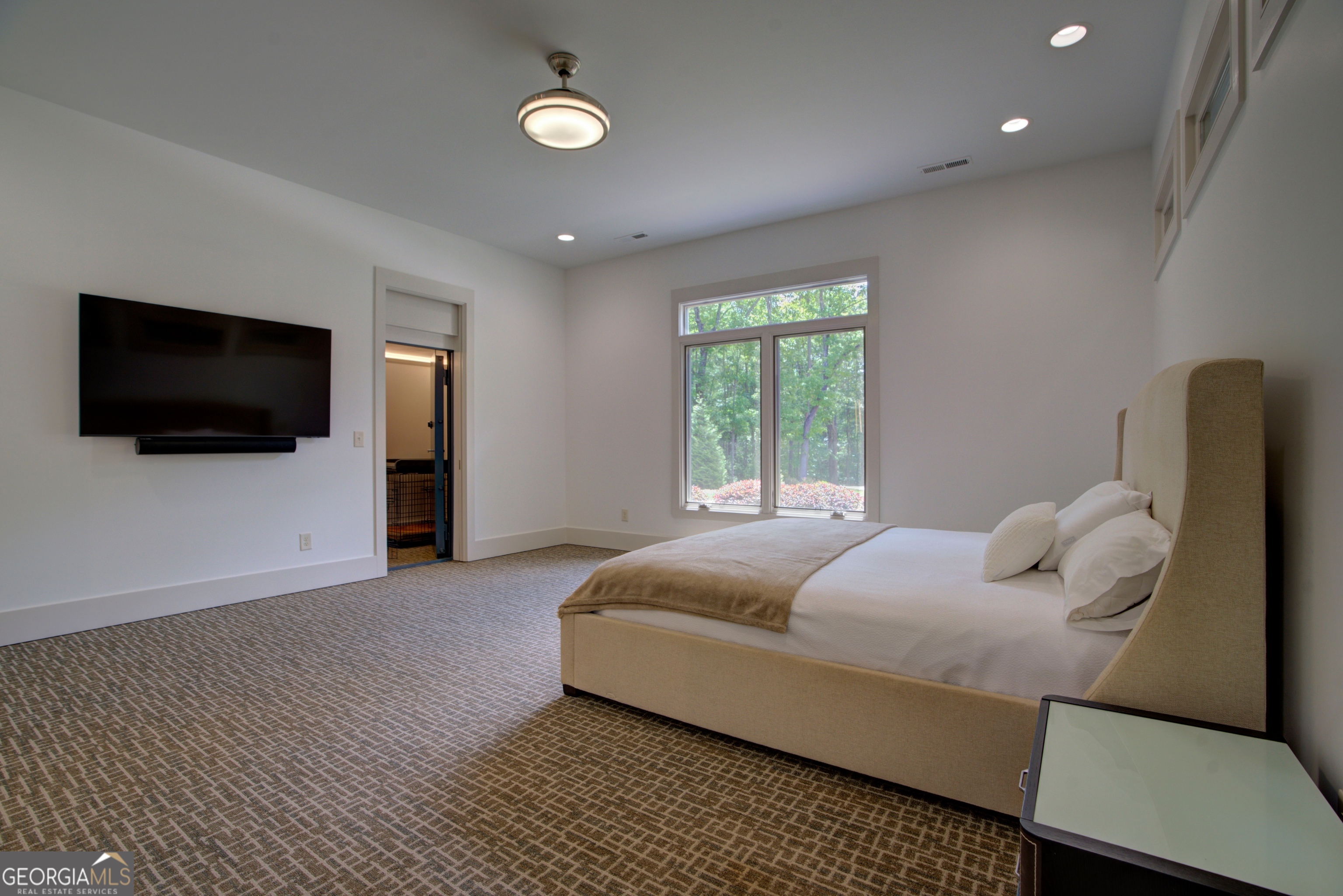 610 Kings Bridge Road Cave Spring, GA 30124 - Photo 15 of 72 a bedroom with a bed and a flat screen tv