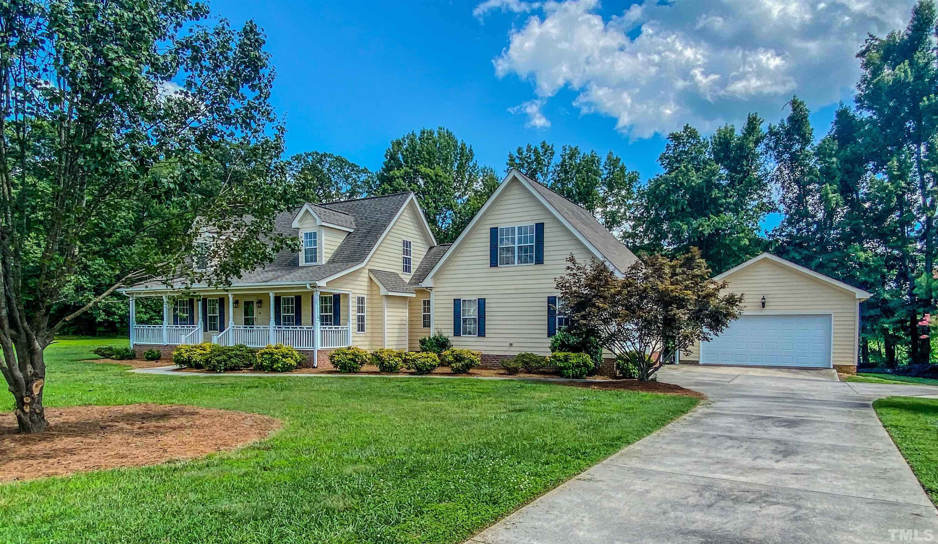151 Fletcher Ridge Road Timberlake, NC 27583 - Photo 1 of 49 a front view of house with yard and green space