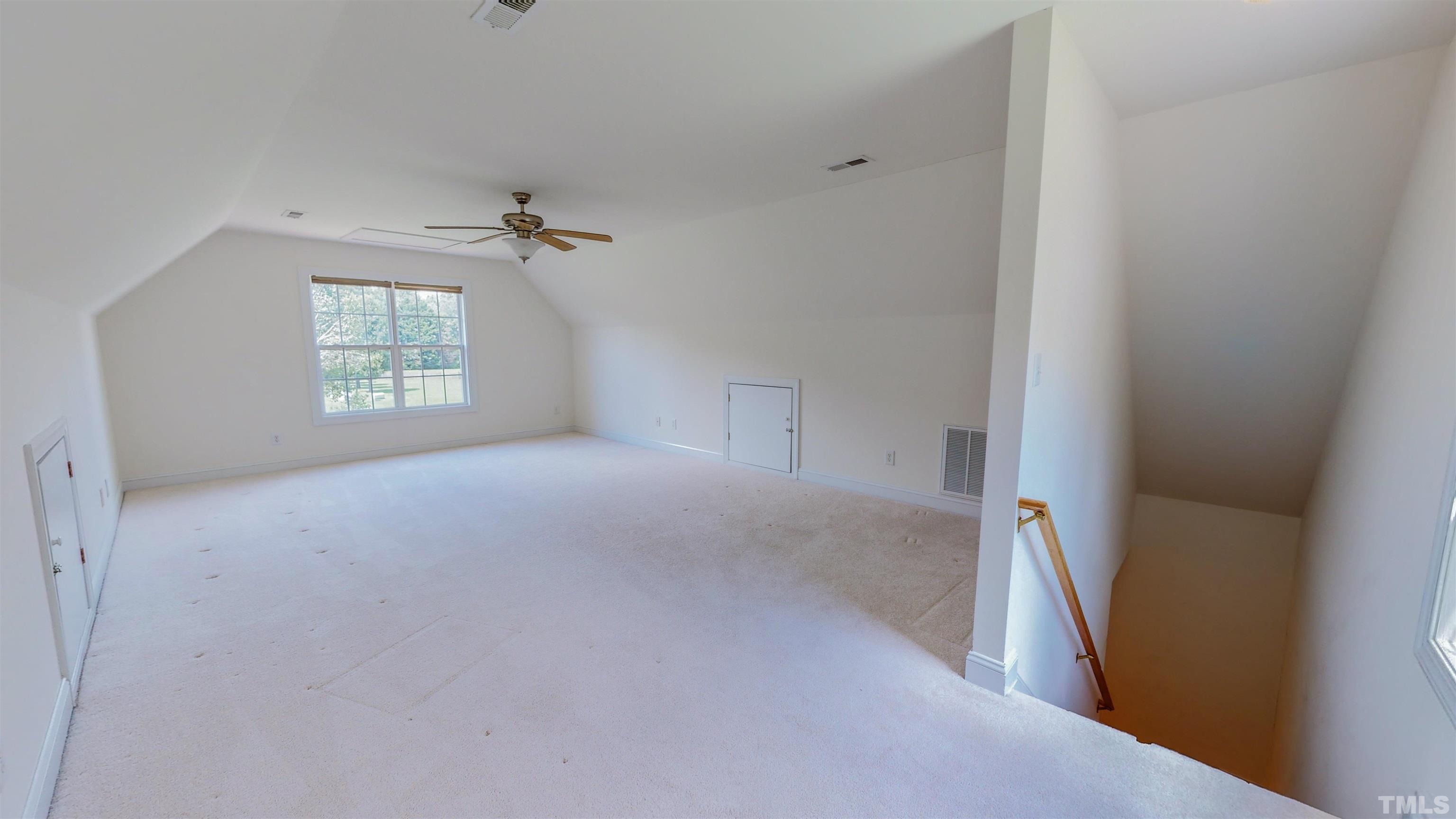 151 Fletcher Ridge Road Timberlake, NC 27583 - Photo 32 of 49 an empty room with windows and closet