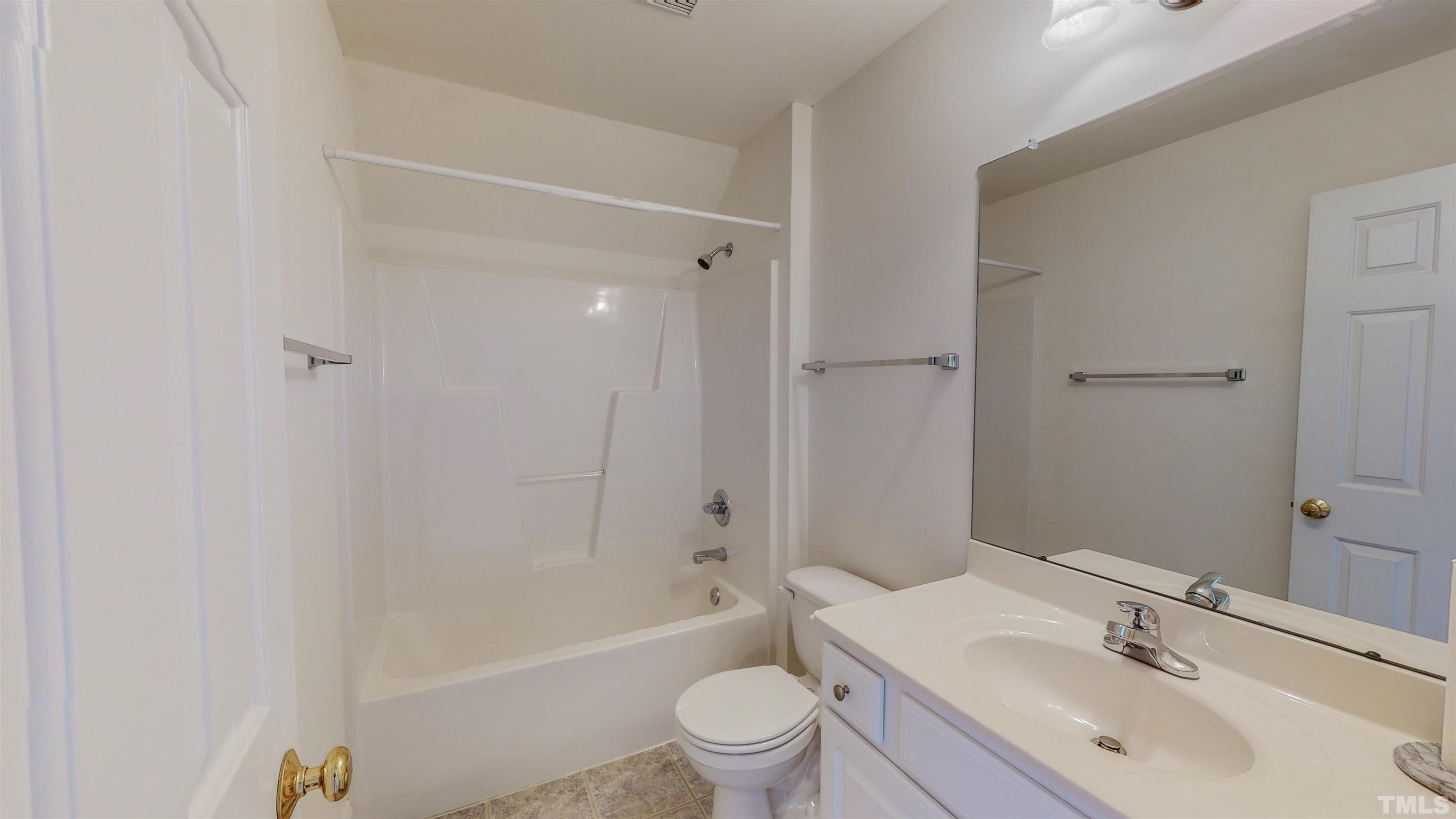 151 Fletcher Ridge Road Timberlake, NC 27583 - Photo 39 of 49 a bathroom with a sink a toilet and shower