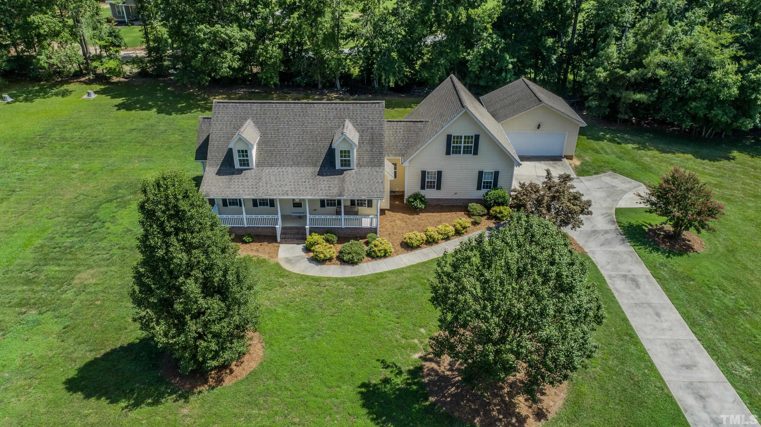 151 Fletcher Ridge Road Timberlake, NC 27583 - Photo 8 of 49 an aerial view of a house with swimming pool garden and outdoor seating