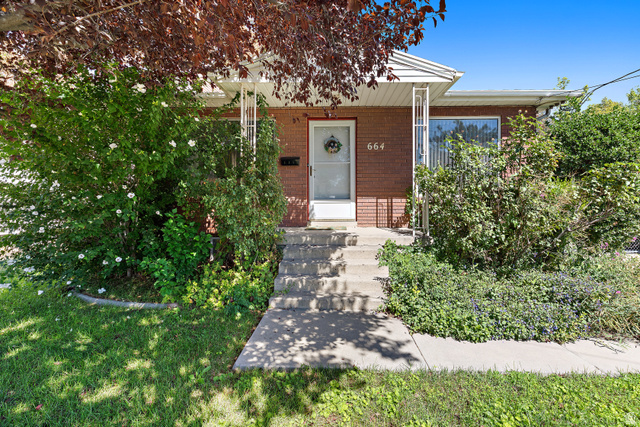 664 Wasatch Street Midvale, UT 84047 - Photo 2 of 33 Brick exterior with a covered porch entry