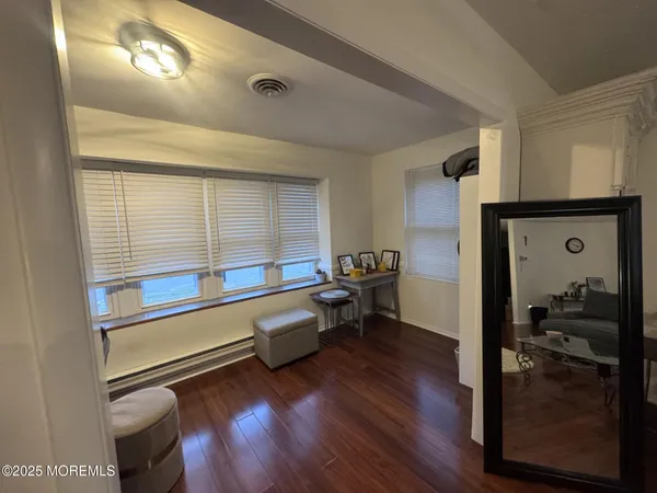 a view of an empty room and a window