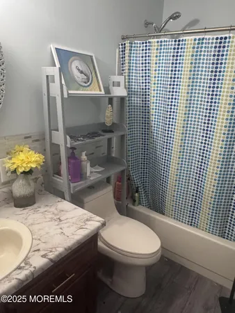 a bathroom with a toilet and a sink
