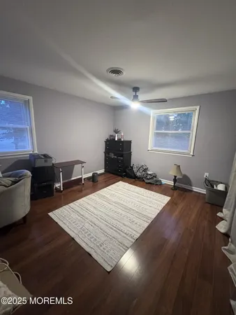 a bed room with a bed and a television