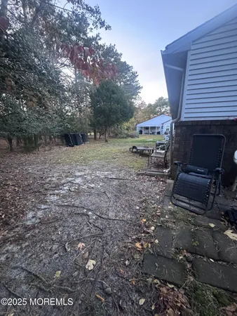 a view of backyard with outdoor space