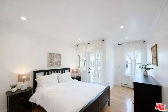 a bedroom with a bed and a lamp