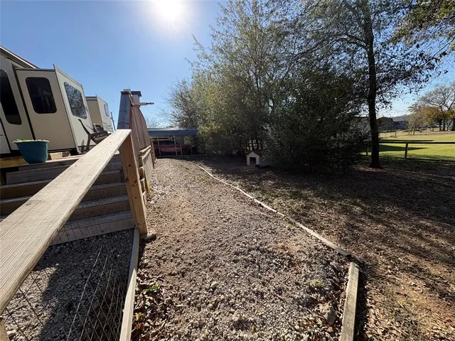 a view of backyard with green space