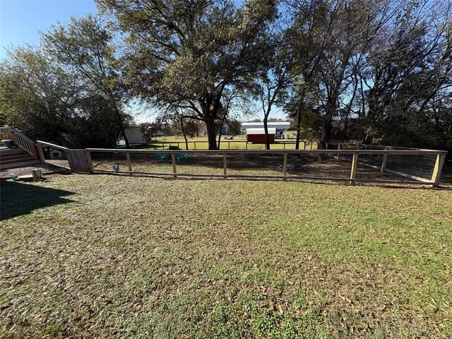 a view of a swimming pool with an outdoor space and seating area