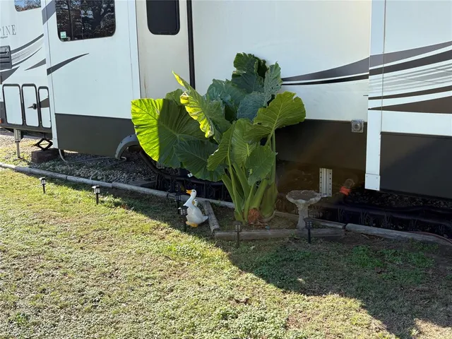 a kitchen with stainless steel appliances a stove and a microwave