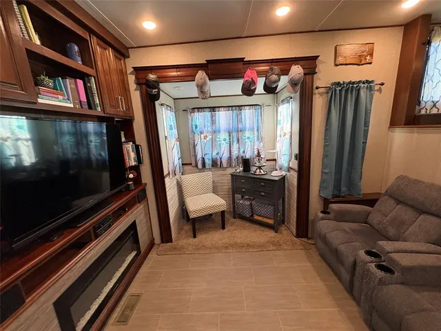 a hallway with painting and a rug