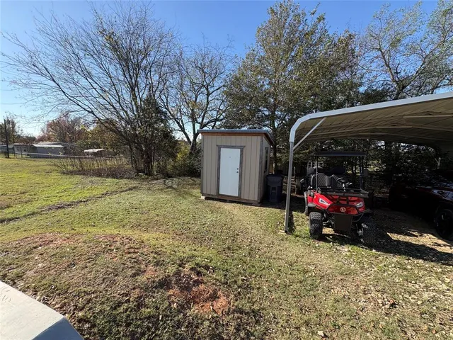 a bed room with a bed next to a window
