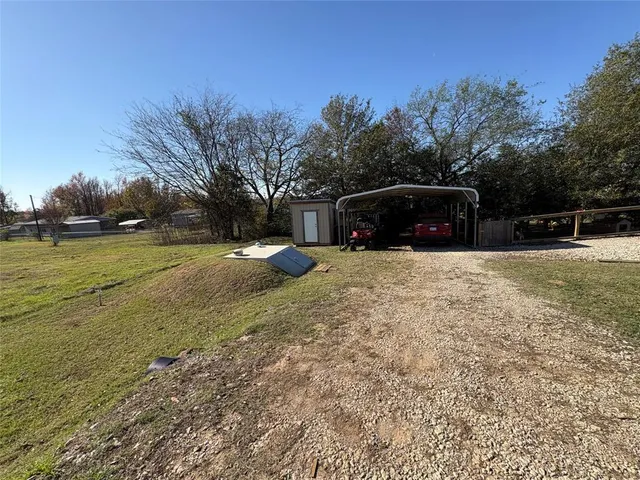 a view of a swimming pool with an outdoor space and seating area
