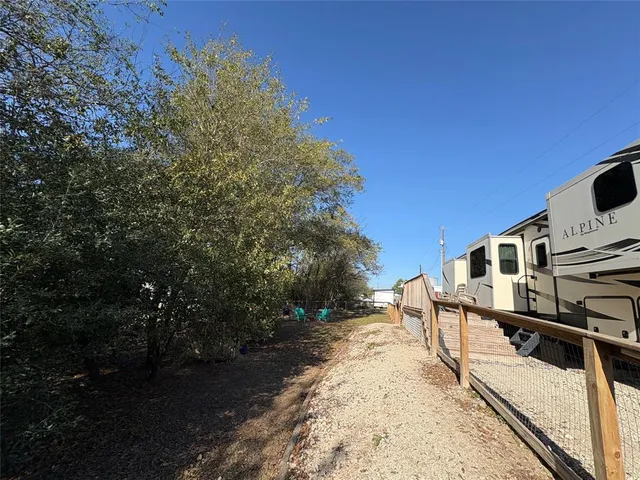 a view of street with large trees