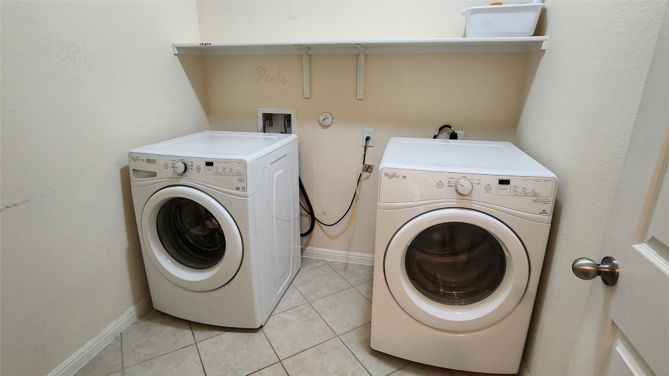 5432 Juniper Jct Lane Austin, TX 78744 - Photo 12 of 26 a utility room with dryer and washer