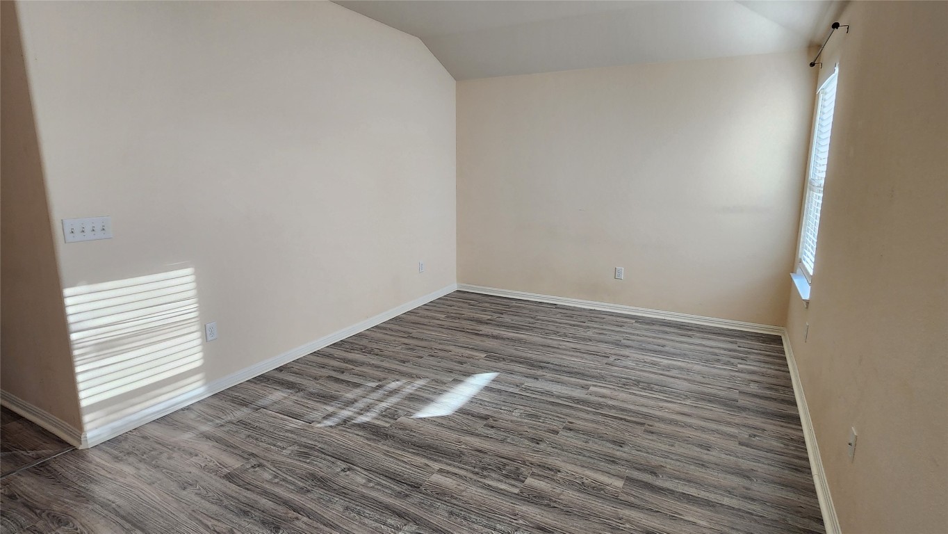 5432 Juniper Jct Lane Austin, TX 78744 - Photo 14 of 26 a view of empty room with wooden floor