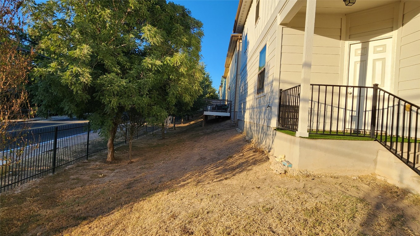 5432 Juniper Jct Lane Austin, TX 78744 - Photo 25 of 26 a view of a backyard with wooden fence