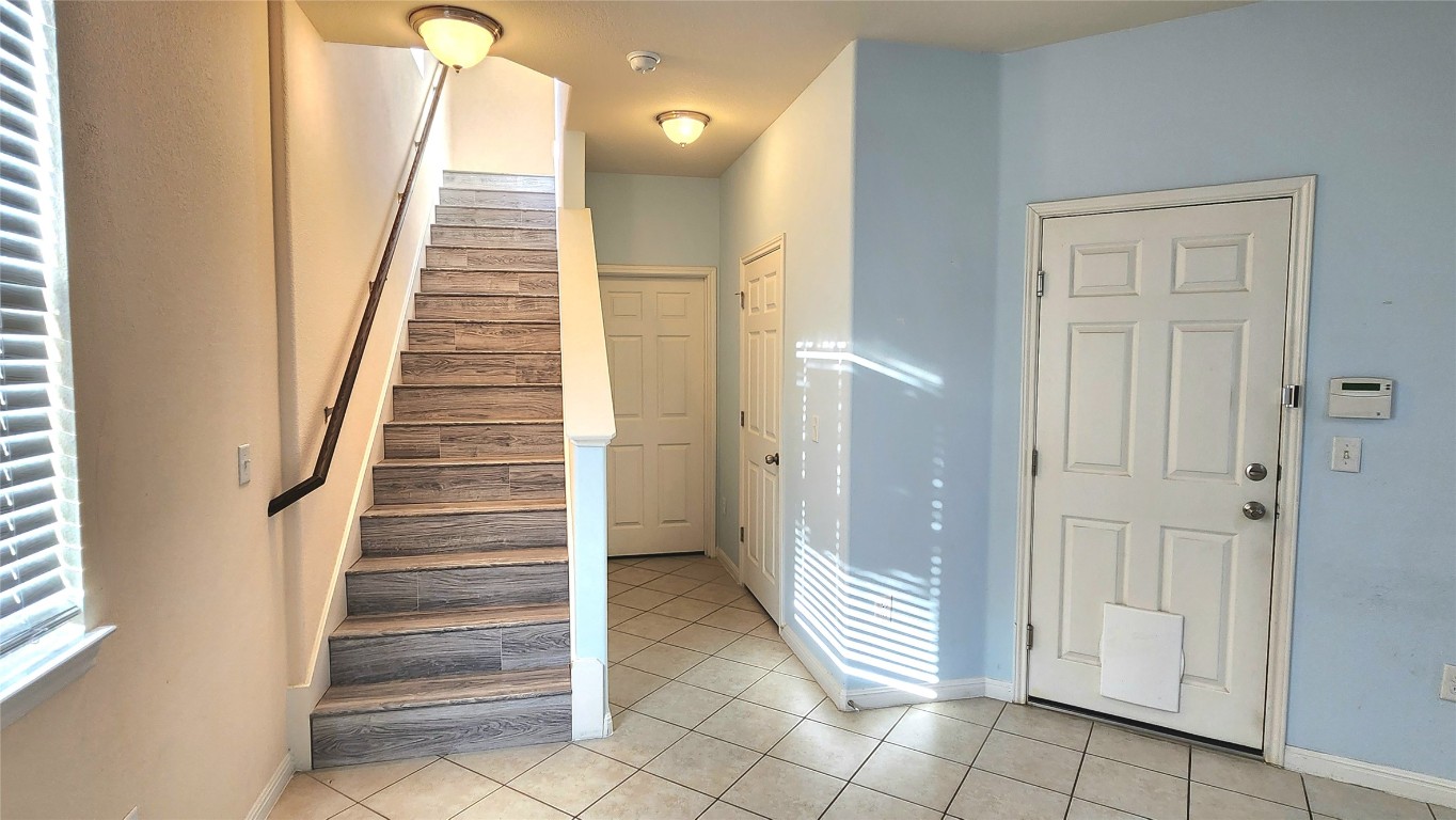 5432 Juniper Jct Lane Austin, TX 78744 - Photo 10 of 26 a view of entryway and hall with a rug