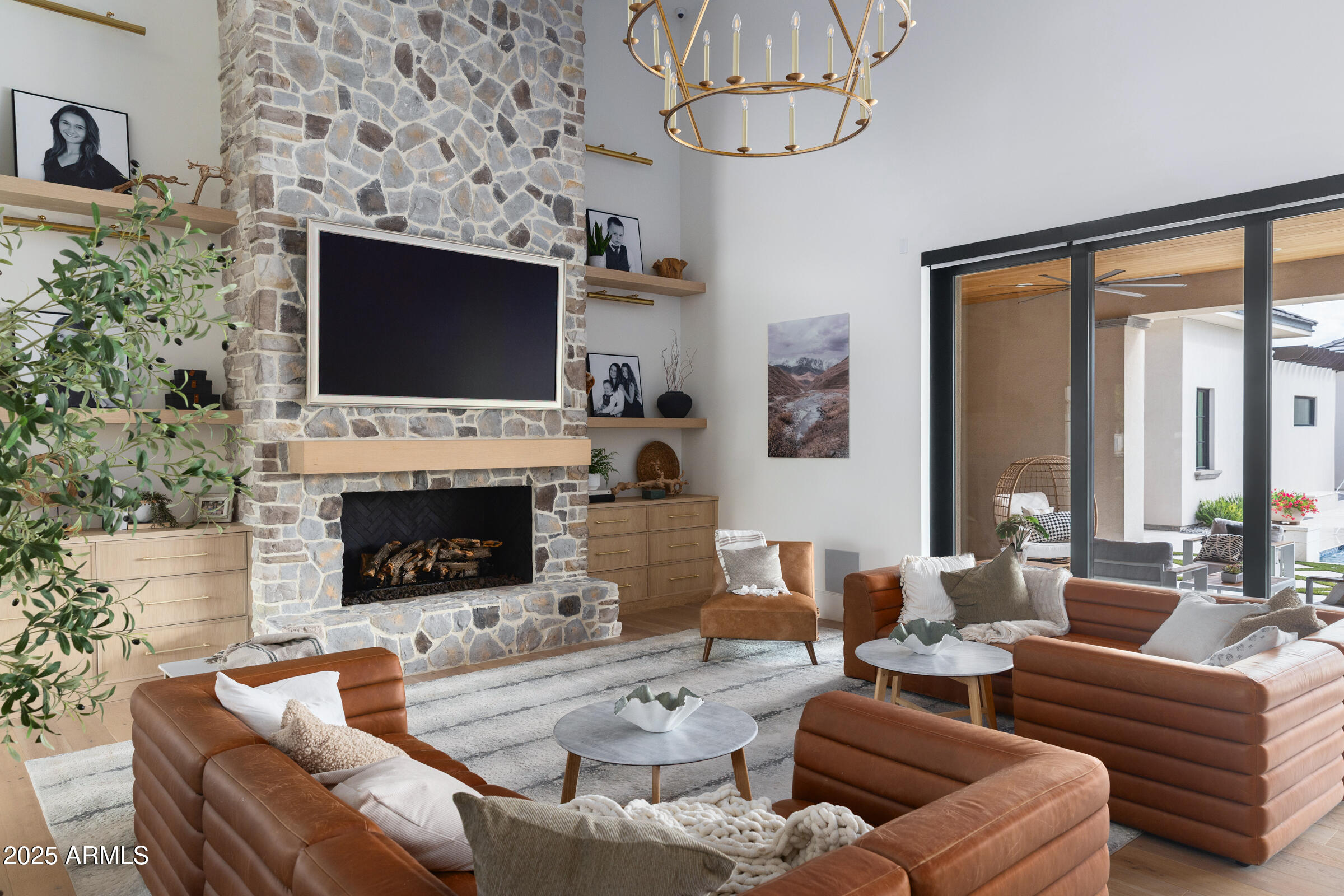20623 East Cloud Road Queen Creek, AZ 85142 - Photo 12 of 115 a living room with furniture a fireplace and a flat screen tv