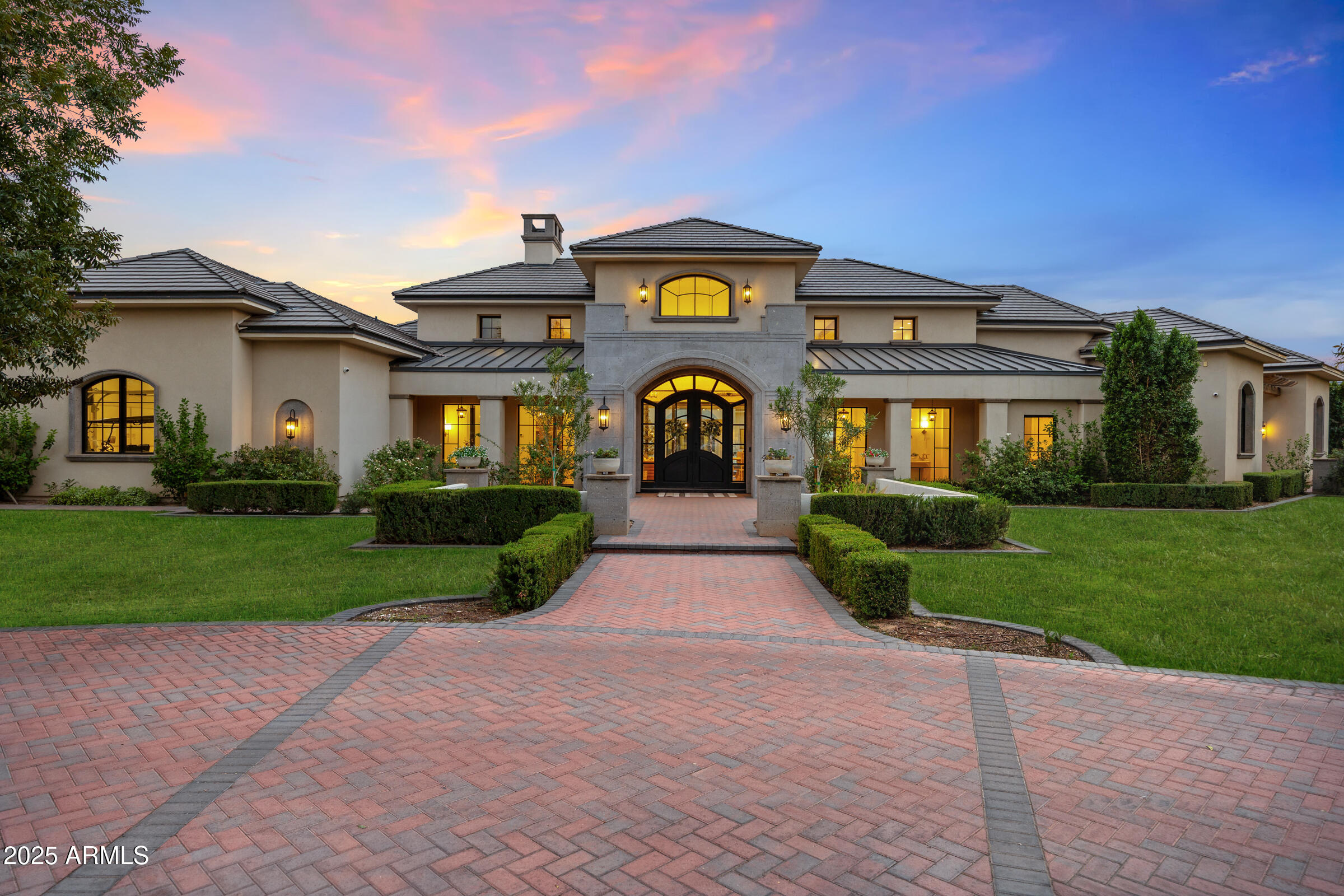 20623 East Cloud Road Queen Creek, AZ 85142 - Photo 2 of 115 a front view of a house with a garden and yard
