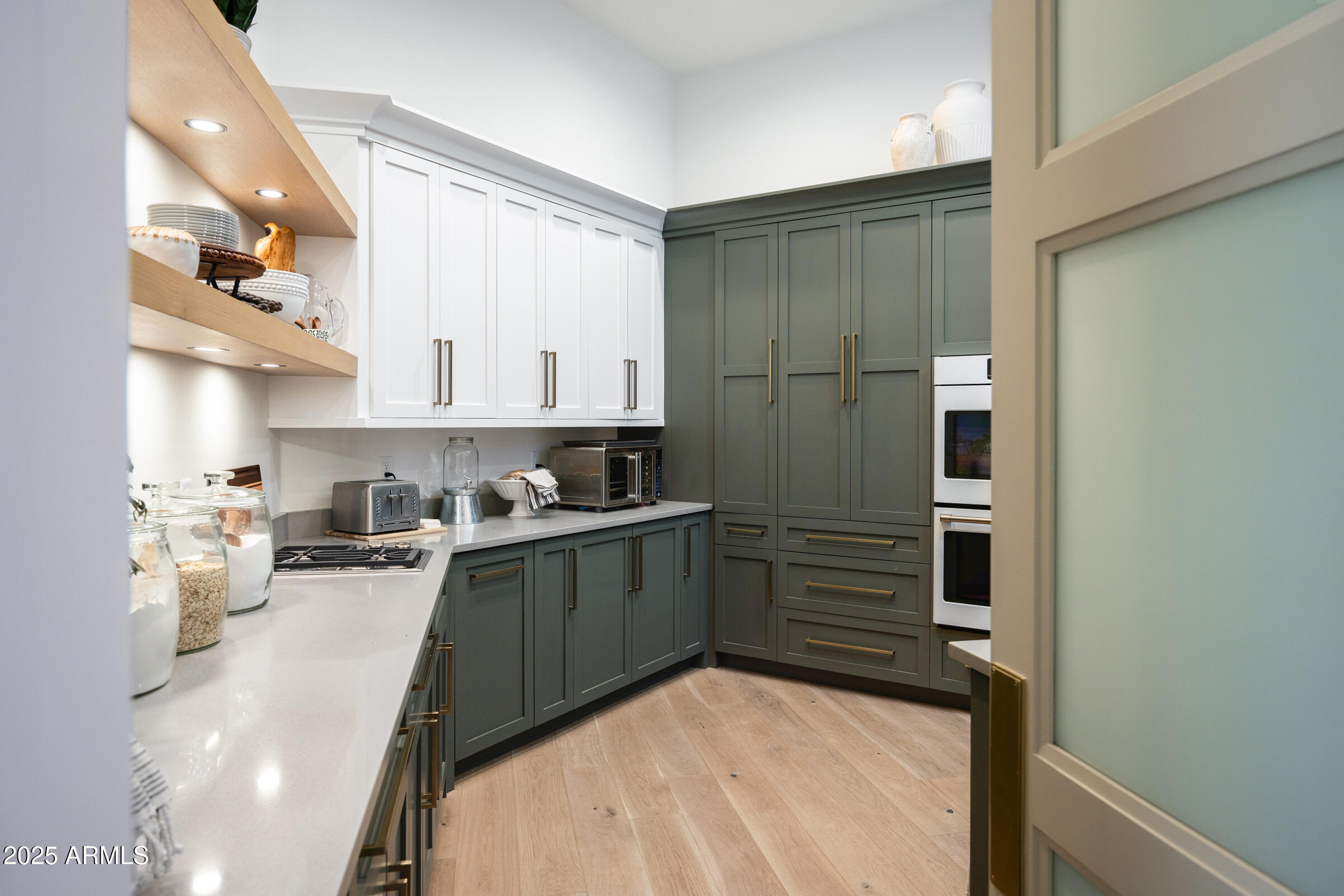 20623 East Cloud Road Queen Creek, AZ 85142 - Photo 25 of 115 a kitchen with a refrigerator and white cabinets