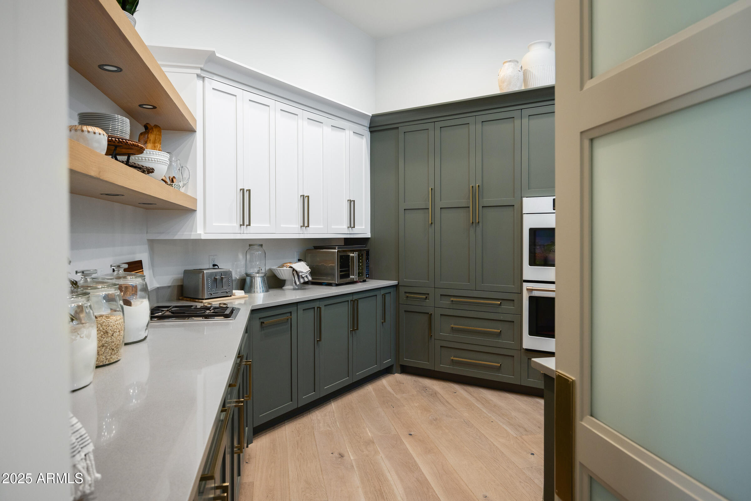20623 East Cloud Road Queen Creek, AZ 85142 - Photo 26 of 115 a kitchen with a refrigerator and white cabinets