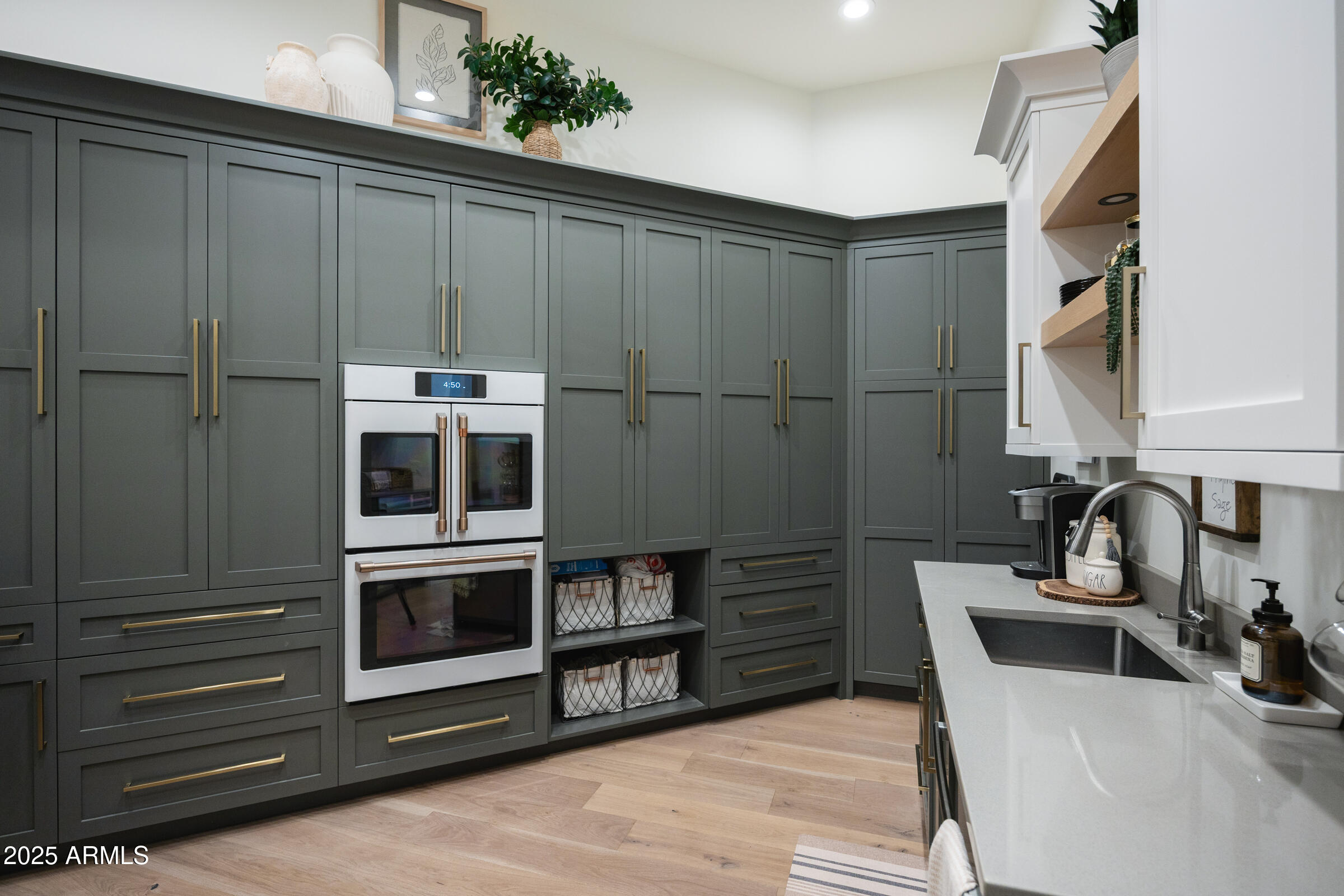 20623 East Cloud Road Queen Creek, AZ 85142 - Photo 27 of 115 a kitchen with stainless steel appliances kitchen island granite countertop a refrigerator and a sink