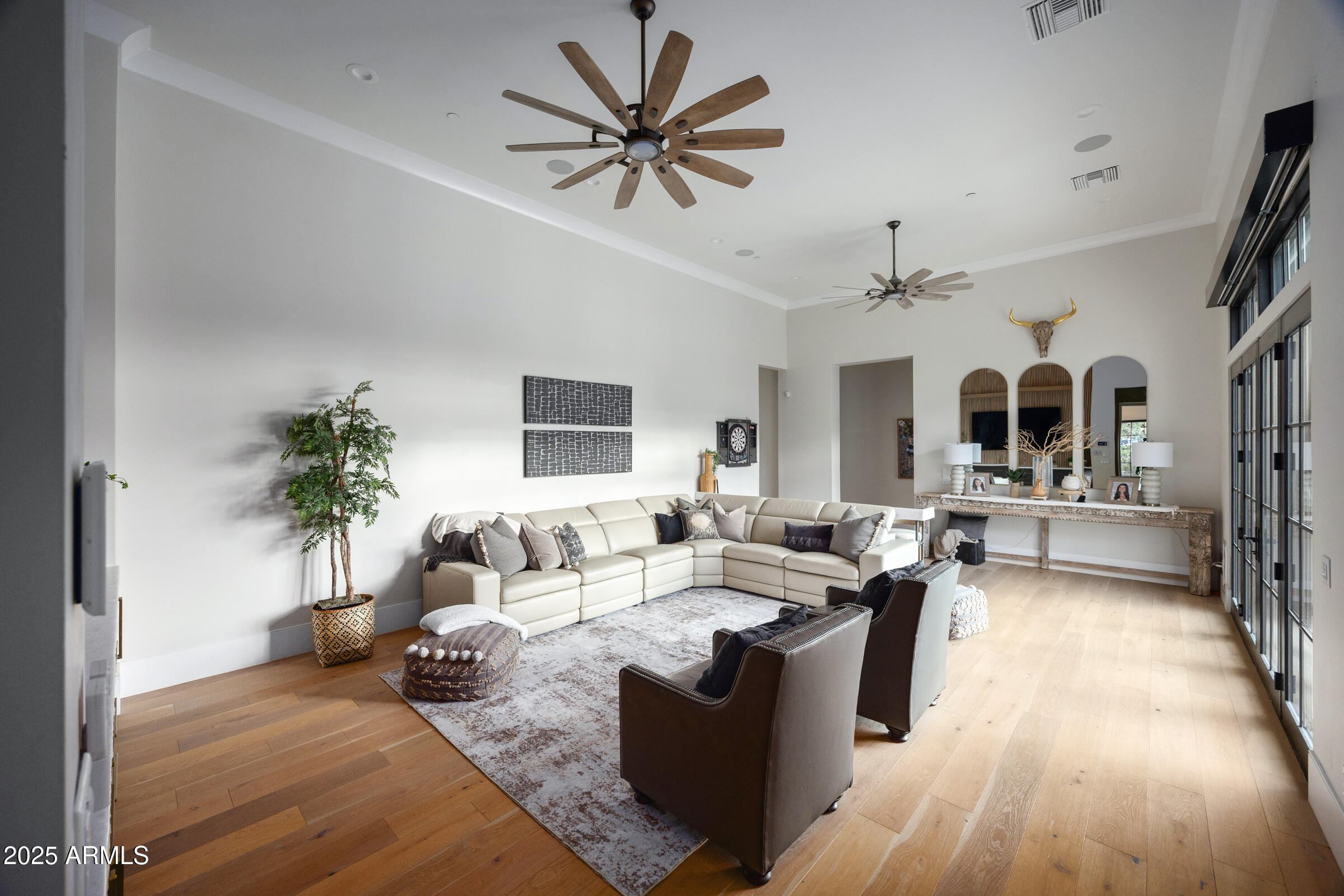 20623 East Cloud Road Queen Creek, AZ 85142 - Photo 43 of 115 a living room with furniture potted plant and a chandelier