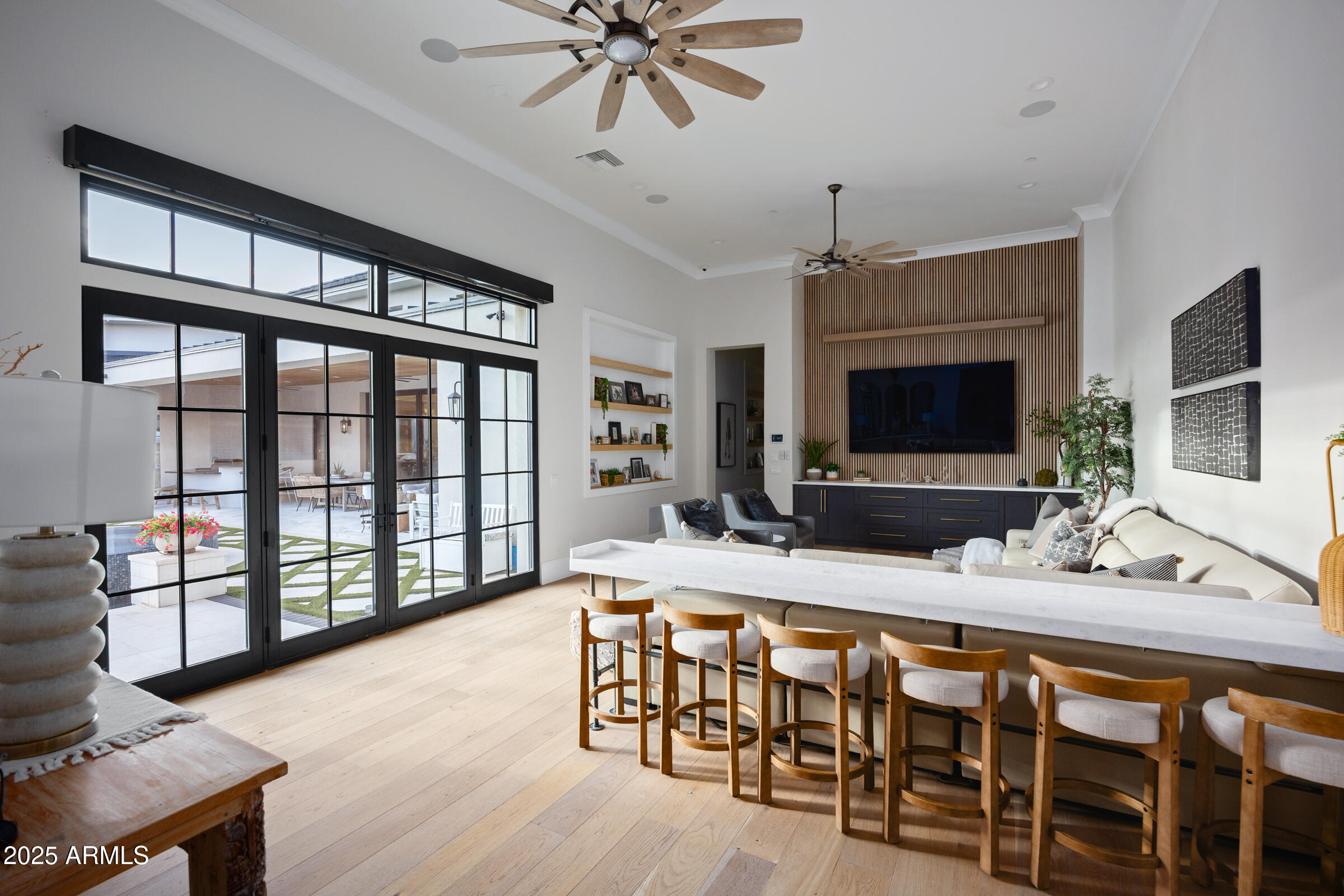 20623 East Cloud Road Queen Creek, AZ 85142 - Photo 44 of 115 a living room with furniture a flat screen tv and a large window