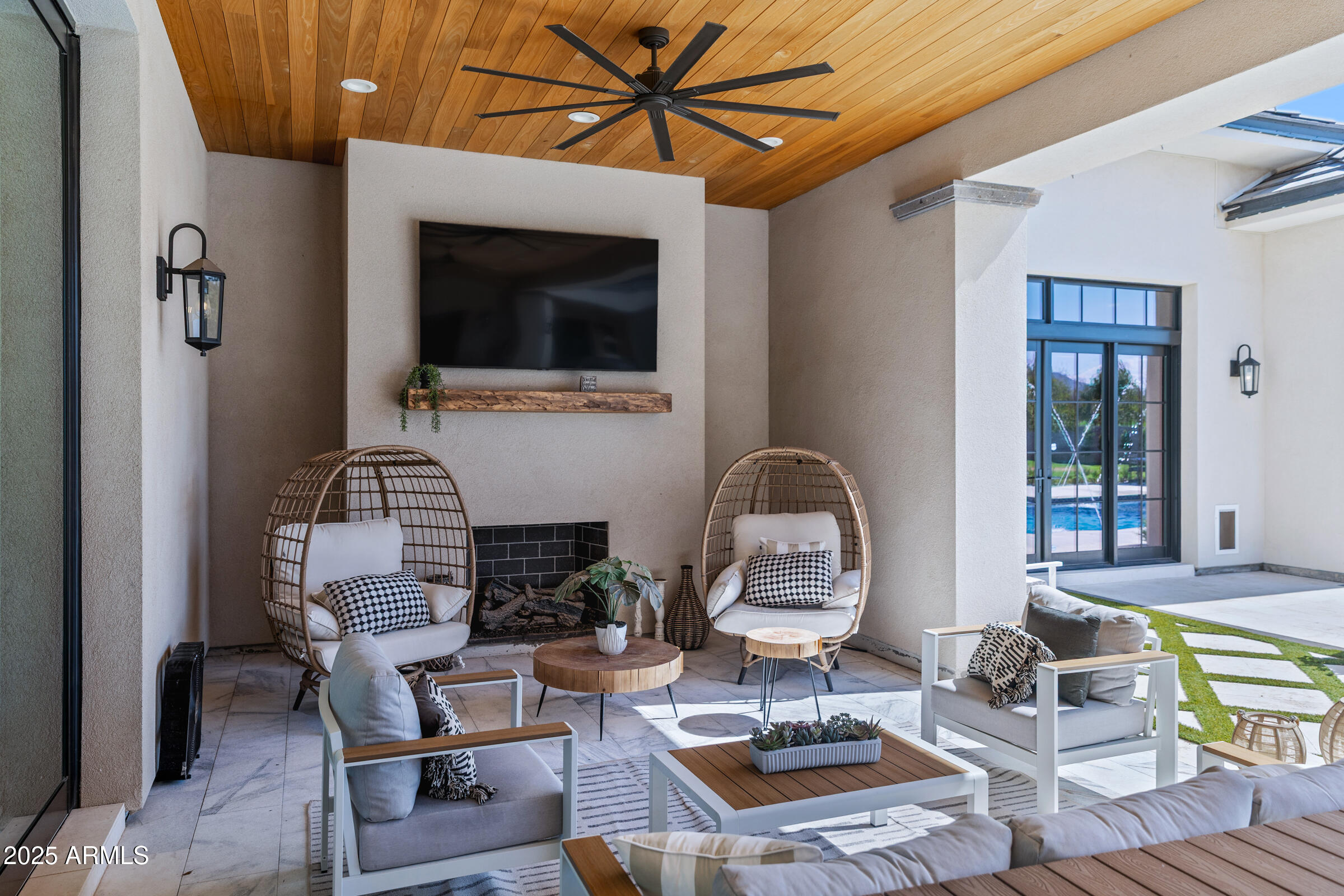 20623 East Cloud Road Queen Creek, AZ 85142 - Photo 57 of 115 a living room with furniture a rug and a fireplace