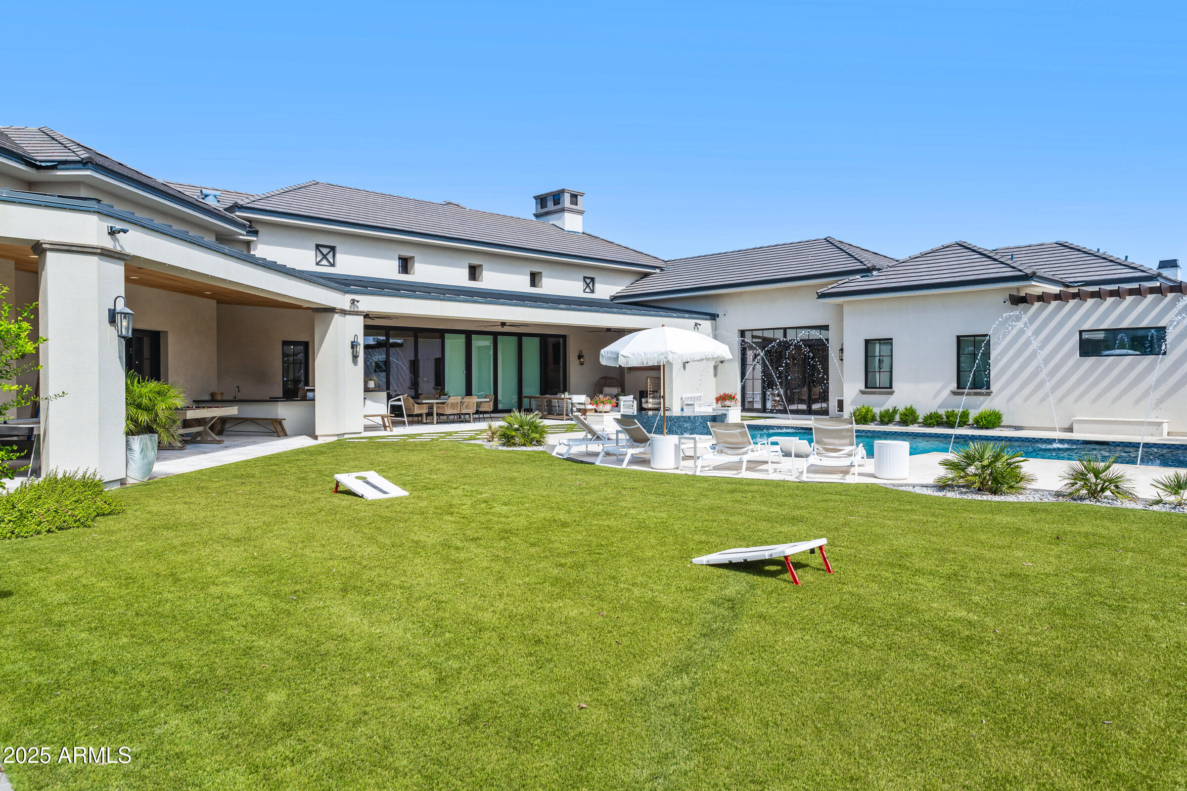 20623 East Cloud Road Queen Creek, AZ 85142 - Photo 62 of 115 a front view of a house with swimming pool having outdoor seating