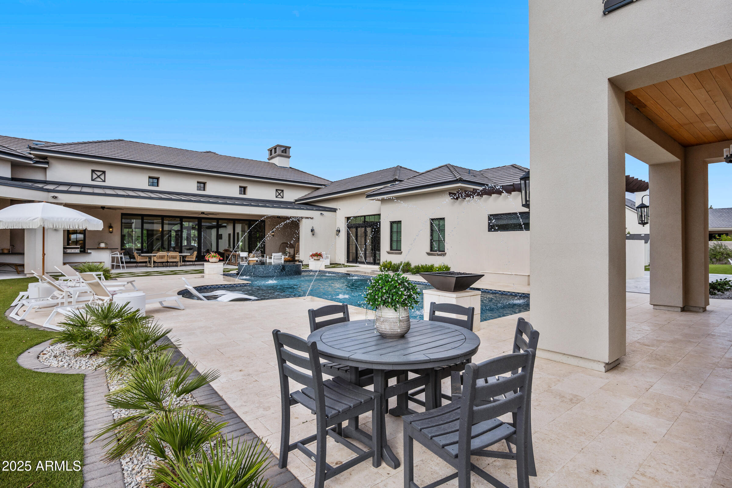 20623 East Cloud Road Queen Creek, AZ 85142 - Photo 69 of 115 a patio with a table and chairs and potted plants