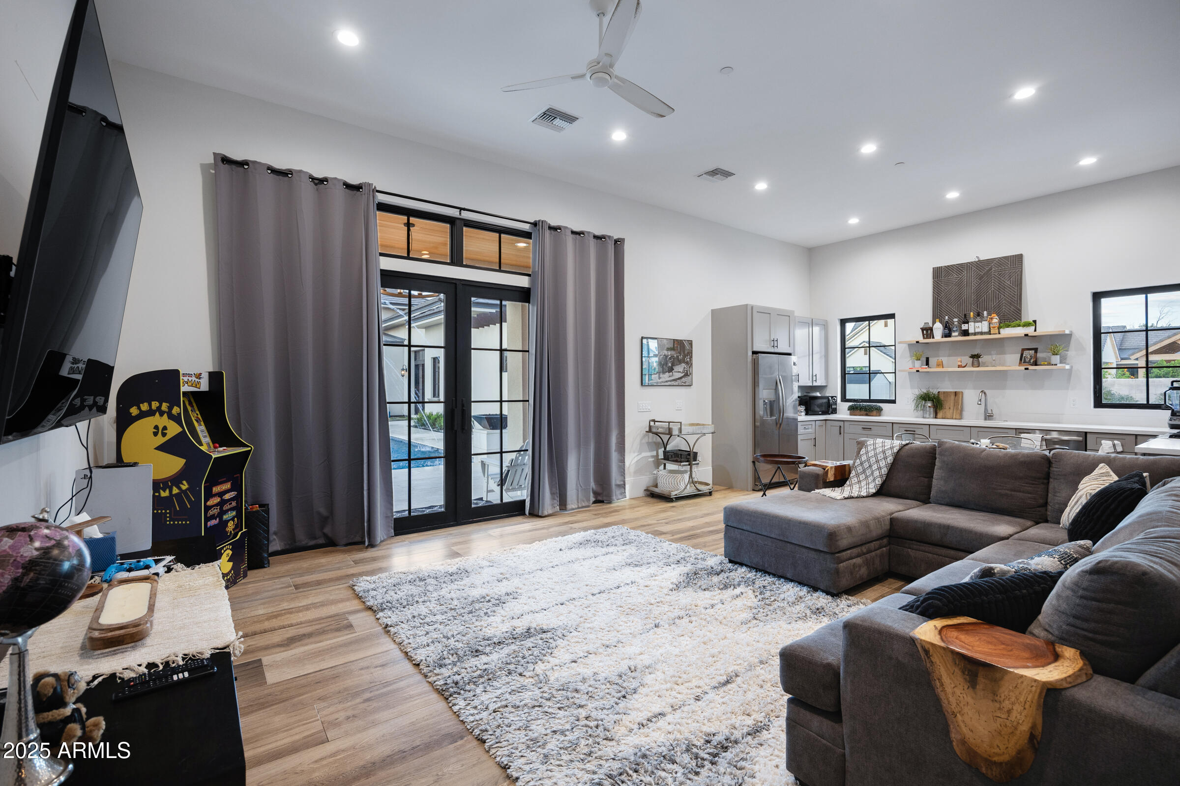 20623 East Cloud Road Queen Creek, AZ 85142 - Photo 73 of 115 a living room with furniture and a flat screen tv
