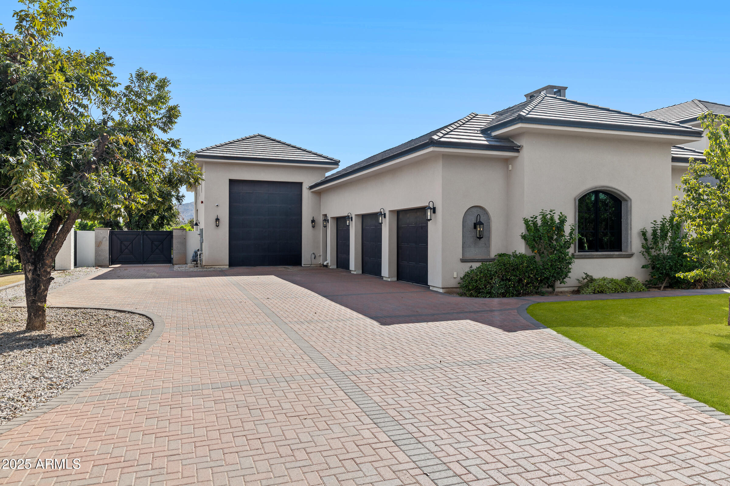 20623 East Cloud Road Queen Creek, AZ 85142 - Photo 8 of 115 a front view of a house with a yard and garage