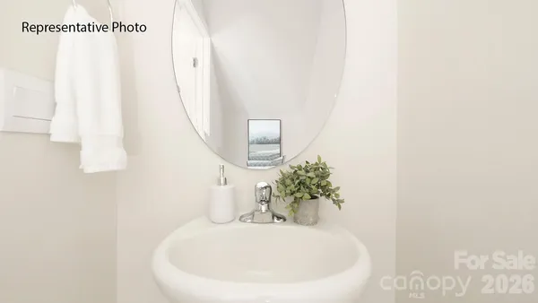 a white bath tub sitting next to a white sink
