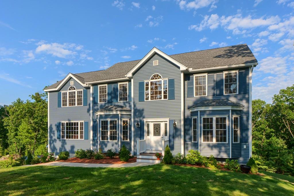 16 Mockingbird Hill Road Groton, MA 01450 - Photo 1 of 41 a front view of a house with a yard and garage