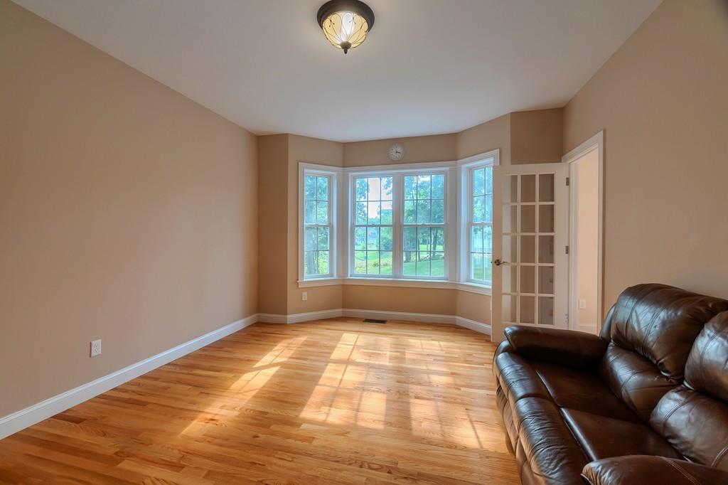 16 Mockingbird Hill Road Groton, MA 01450 - Photo 8 of 41 a living room with furniture and a large window