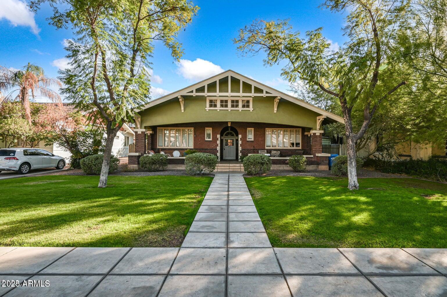 343 West Portland Street, Unit 5 Phoenix, AZ 85003 - Photo 1 of 10 a front view of a house with a yard