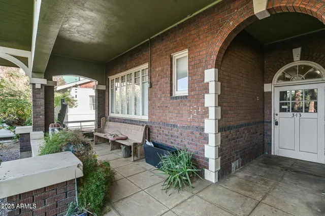 a front view of a house with garden