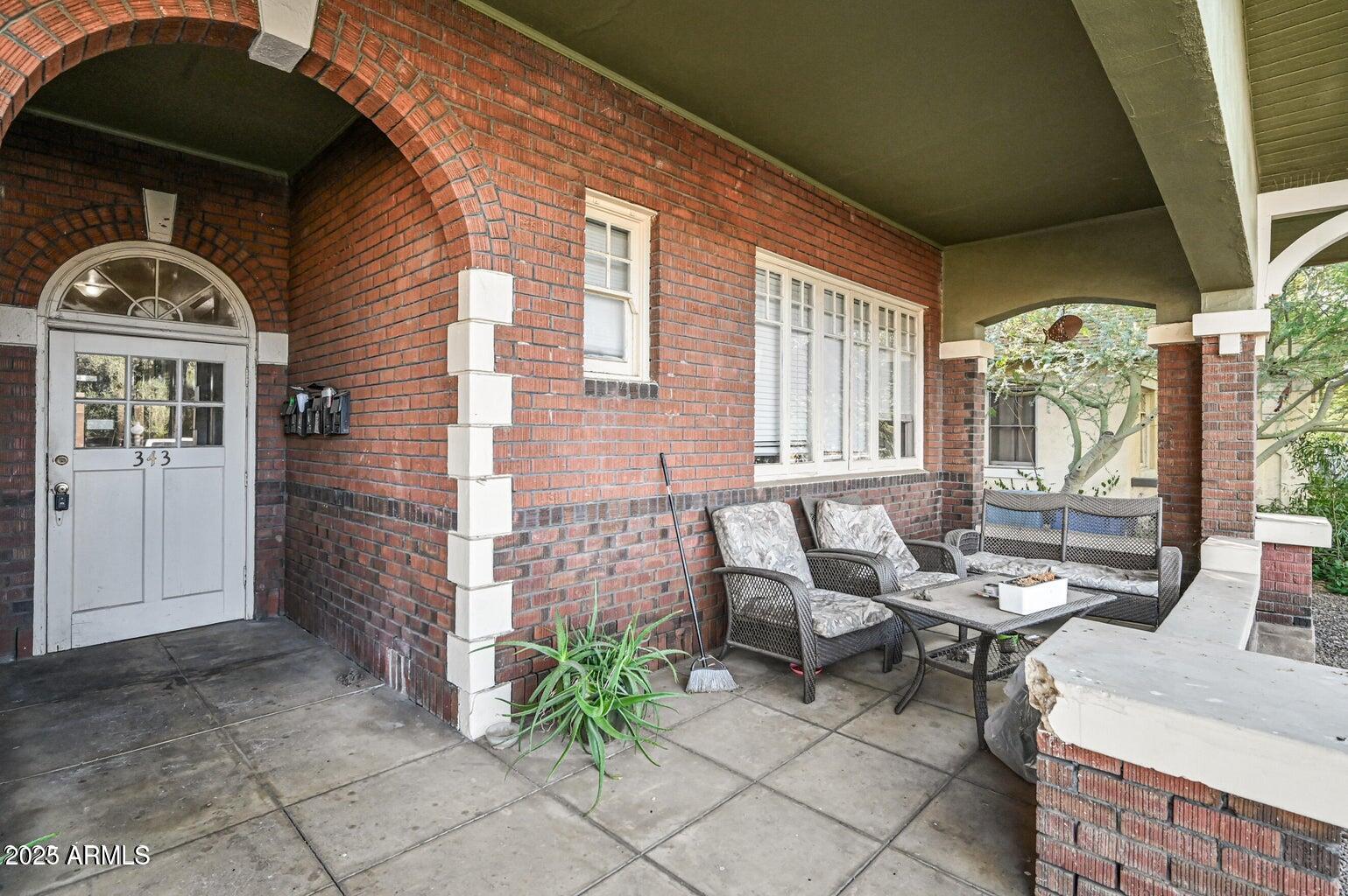 343 West Portland Street, Unit 5 Phoenix, AZ 85003 - Photo 3 of 10 a front view of a house with outdoor seating