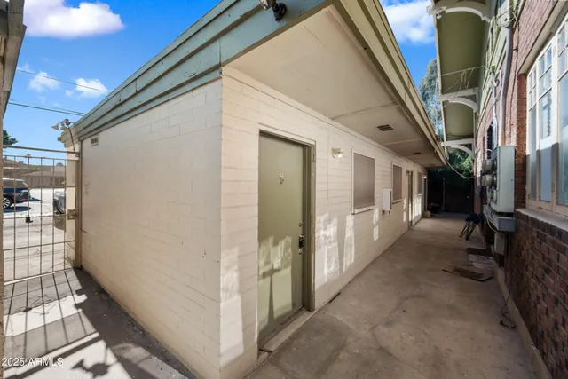 a view of a porch with wooden floor