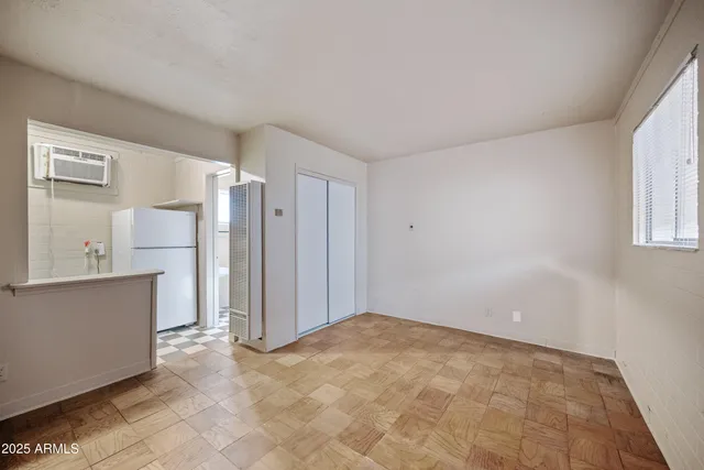 a view of an empty room with a window