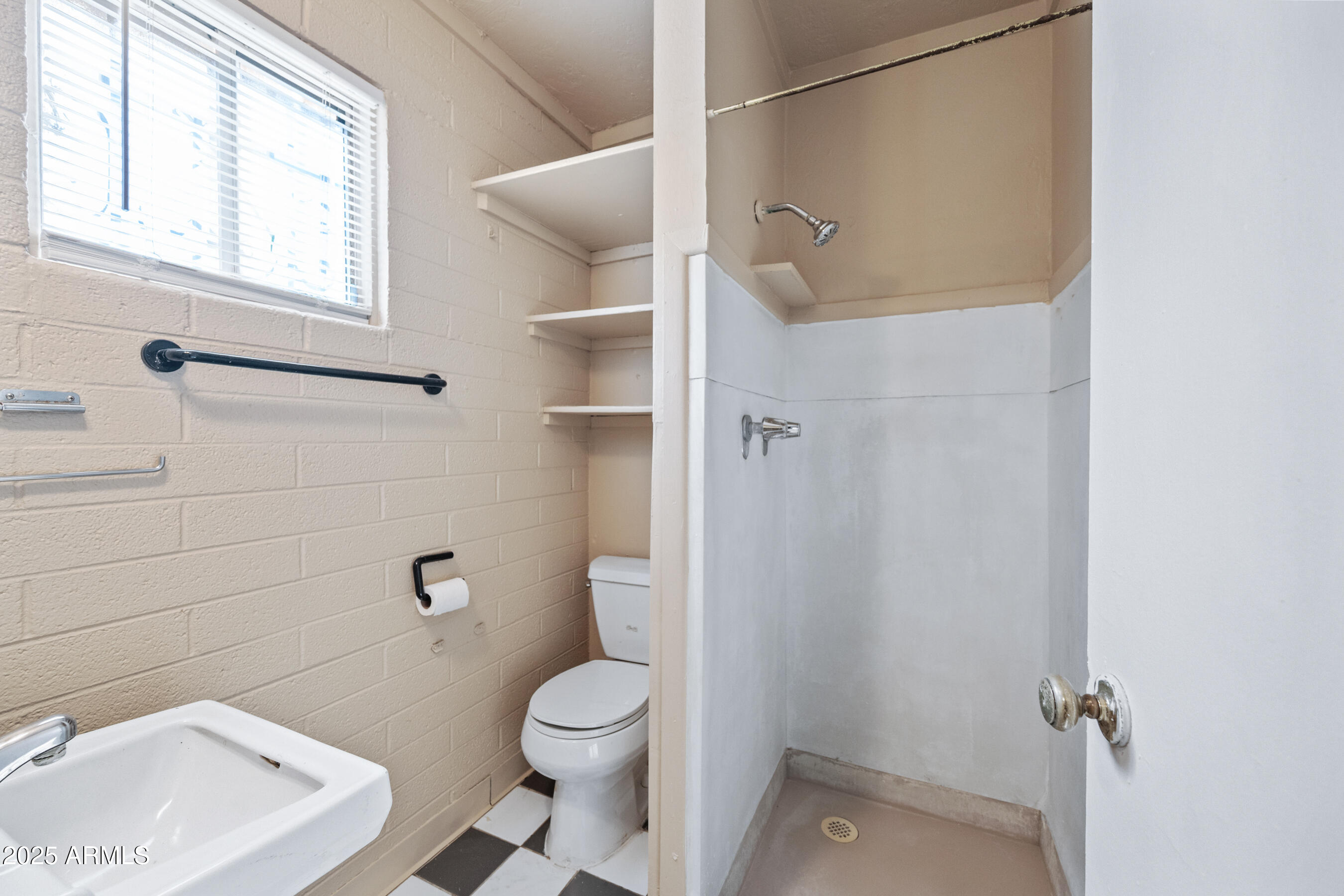 343 West Portland Street, Unit 5 Phoenix, AZ 85003 - Photo 10 of 10 a bathroom with a toilet a sink and bath tub