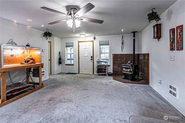 a view of a livingroom with furniture and a flat screen tv
